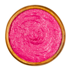 Beetroot bread spread, in a wooden bowl, from above. Beet spread, with an intense purple color, made with cooked red beets. Colorful, healthy and vegan food. Close-up, on white background, food photo.