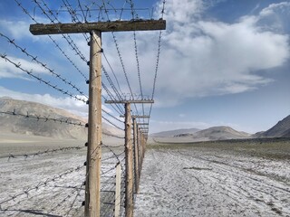 Barbed wire between borders on the Pamir Highway
