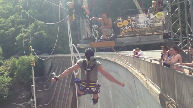 Berlin, Germany - April 2014 - Bungee jumping, a man attached to a cable jumps from a high dam into a gorge