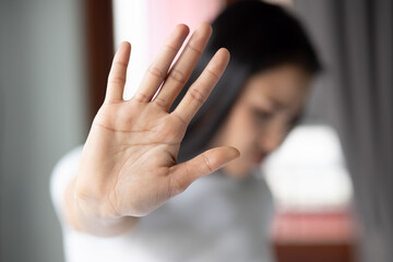 rejecting woman saying stop, no, halt with hand gesture - obrazy, fototapety, plakaty