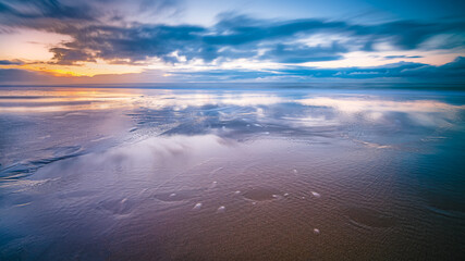 Sunset over beach at North sea coast