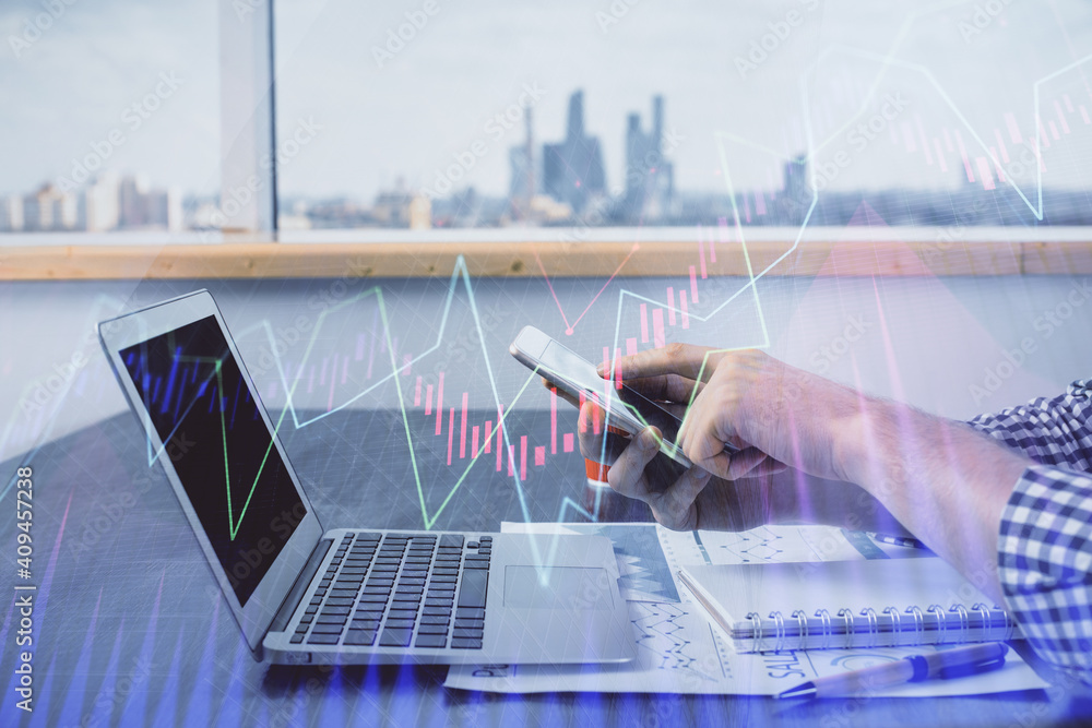 Poster double exposure of man's hands holding and using a digital device and forex graph drawing. financial