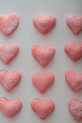 homemade pink cookies for valentine's day on a white background as a symbol of the holiday of all lovers.