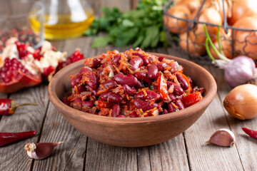 Stewed red beans with carrot in spicy tomato sauce, lobio - vegetarian food - diet and herbs