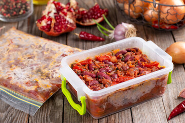 Frozen stewed red beans in tomato sauce on the table
