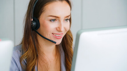 Business people wearing headset working in office to support remote customer or colleague. Call...