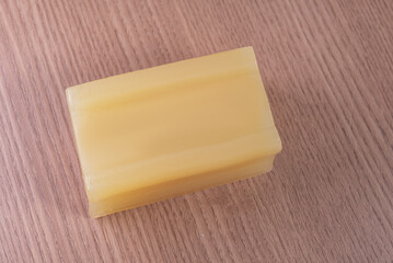 Bar of glycerin soap on the wooden background