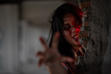 Close-up portrait of a scary bloody zombie girl. Horror. Halloween.