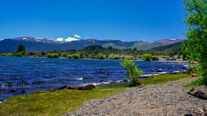 Fototapeta na wymiar Lake Lolog landscape on a summer warm afternoon under a blue sky. San Martin de los Andes, Neuquen, Argentina 