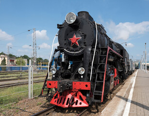 The locomotive of the last century standing under steam