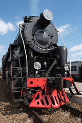 The locomotive of the last century standing under steam