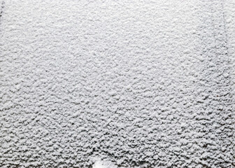 Abstract snow texture fragments on film greenhouse, white snow, winter day