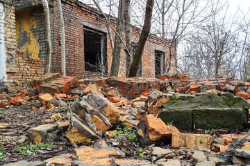 Abandoned destroyed old brick house in city.