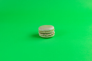 pistachio macaroon isolated with green background