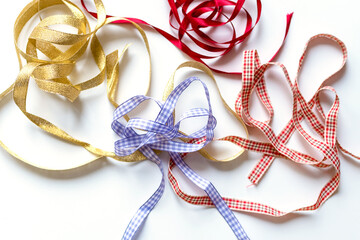 Collection of different gift ribbons on a white background.