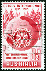 Obraz premium Postage stamp Australia 1955 globe, flags and Rotary emblem