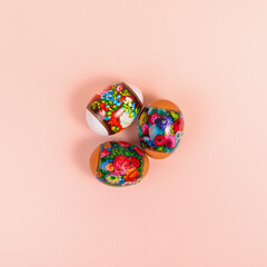 Easter. Khokhloma eggs on a uniform pink background. Place for text.