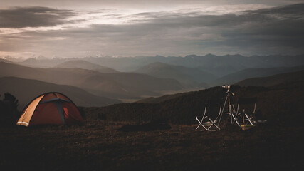 orange tent in the mountains