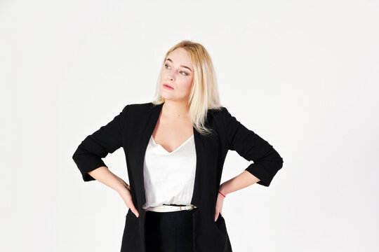Studio portrait of blonde girl isolated on white background.
