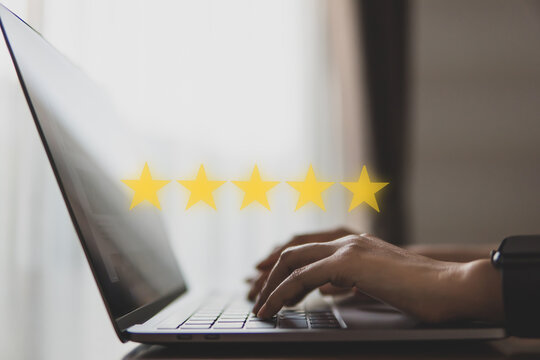 5star concept of testimonial and review, people use computer laptop for review rating online.
