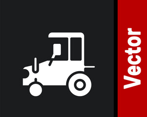 White Tractor icon isolated on black background. Vector.