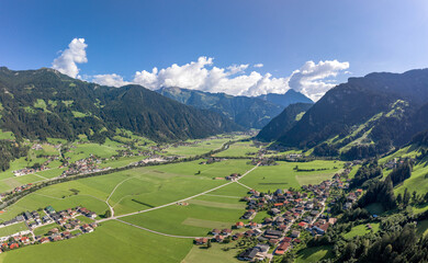 Aerial drone shot of Zillertal valley with clouds in Tyrol Austria summer