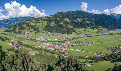 Fototapeta na wymiar Aerial drone shot of Zillertal valley with clouds in Tyrol Austria summer