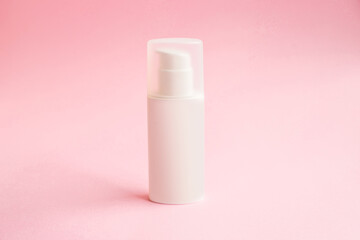 One bottle of cream with dispenser on pink background mockup. beauty spa medical skincare and cosmetic lotion cream packaging product, medicine serum for anti-aging collagen facial, cleansing