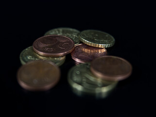 Some coins with closeup on black background european money