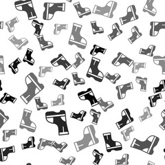 Black Fire boots icon isolated seamless pattern on white background. Vector.