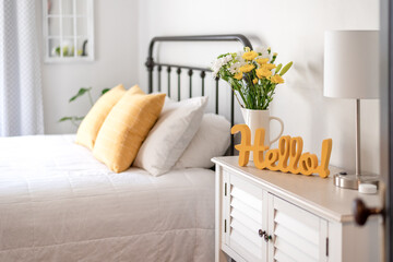 Cheerful hello sign in clean and bright bedroom - 409481882