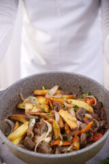 Peruvian dish known by the name of lomo saltado, prepared with pieces of beef tenderloin, tomatoes, yellow pepper, peppers, onion and other vegetables.