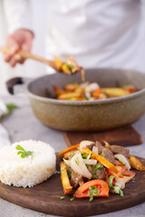 Peruvian dish known by the name of lomo saltado, prepared with pieces of beef tenderloin, tomatoes, yellow pepper, peppers, onion and other vegetables.