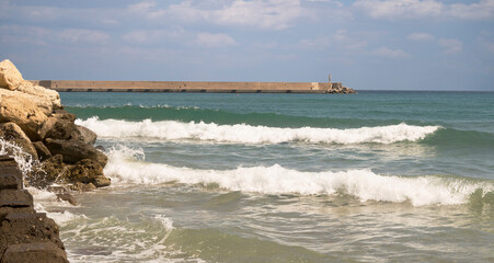 Surf on the sea in the town of Rethymno, Crete
