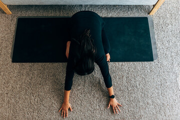 Latin Woman Doing Yoga Stretch At Home