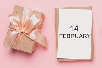 Gifts with note letter on isolated pink background, love and valentine concept with text14 february
