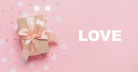 Gifts on pink background, love and valentine concept with text love