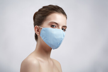 Girl in protective mask isolated on white background.