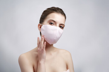 Woman in protective mask on white background