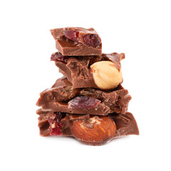 Chocolate pieces stack with nuts and berries, isolated on white background. Close up.