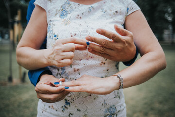 Closeup shot of a bride and groom exchanging their wedding rings