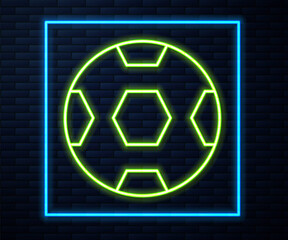 Glowing neon line Football ball icon isolated on brick wall background. Soccer ball. Sport equipment. Vector.