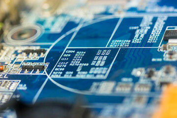 The reverse side of the microboard on a blue background. Electronic board with electrical...