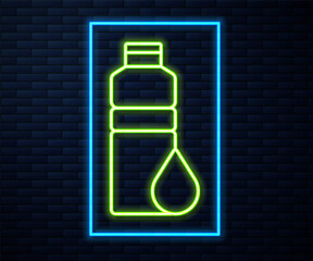 Glowing neon line Fitness shaker icon isolated on brick wall background. Sports shaker bottle with lid for water and protein cocktails. Vector.