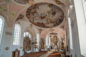 Obraz na płótnie Canvas Interior architecture with furniture, decorations, frescoes and sculptures of the church of Paul Catholic Parish and St Peter in Oberammergau,