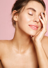 Skin care and makeup. Young woman with nude makeup and naked body, touching soft nourished skin on...