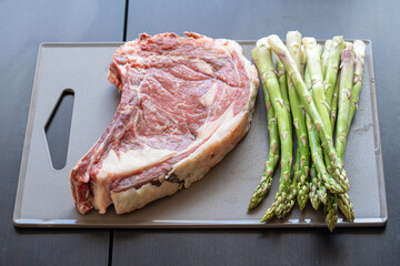 Grilled beef steak with asparagus. Food for barbecue concept.