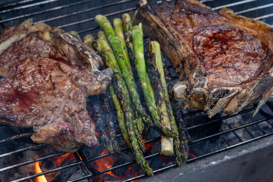 Grilled beef steak with asparagus. Food for barbecue concept.