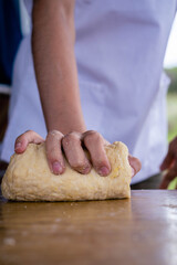 close-up of bakery production making bread with flour eggs rolling pin or rolling pin oil on wooden base background green field with sun in vacations cordoba argentina