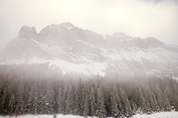 Snowy mountain landscape with clouds